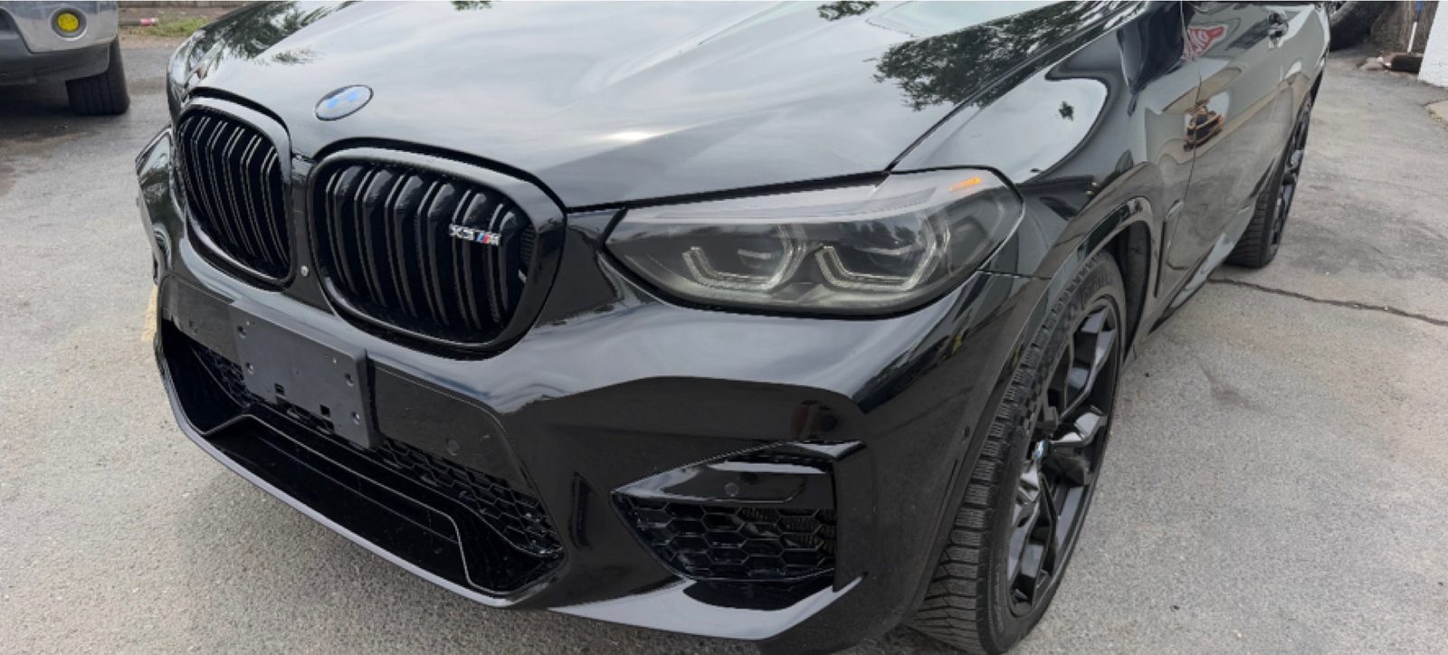 The same BMW X4 M with the front end rebuilt and refinished.