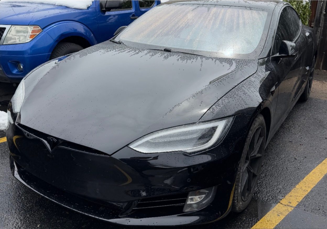 The same Tesla Model S with the front end rebuilt and refinished.